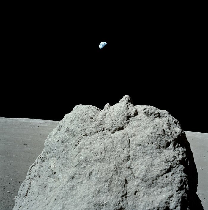 Земля на фоне камня